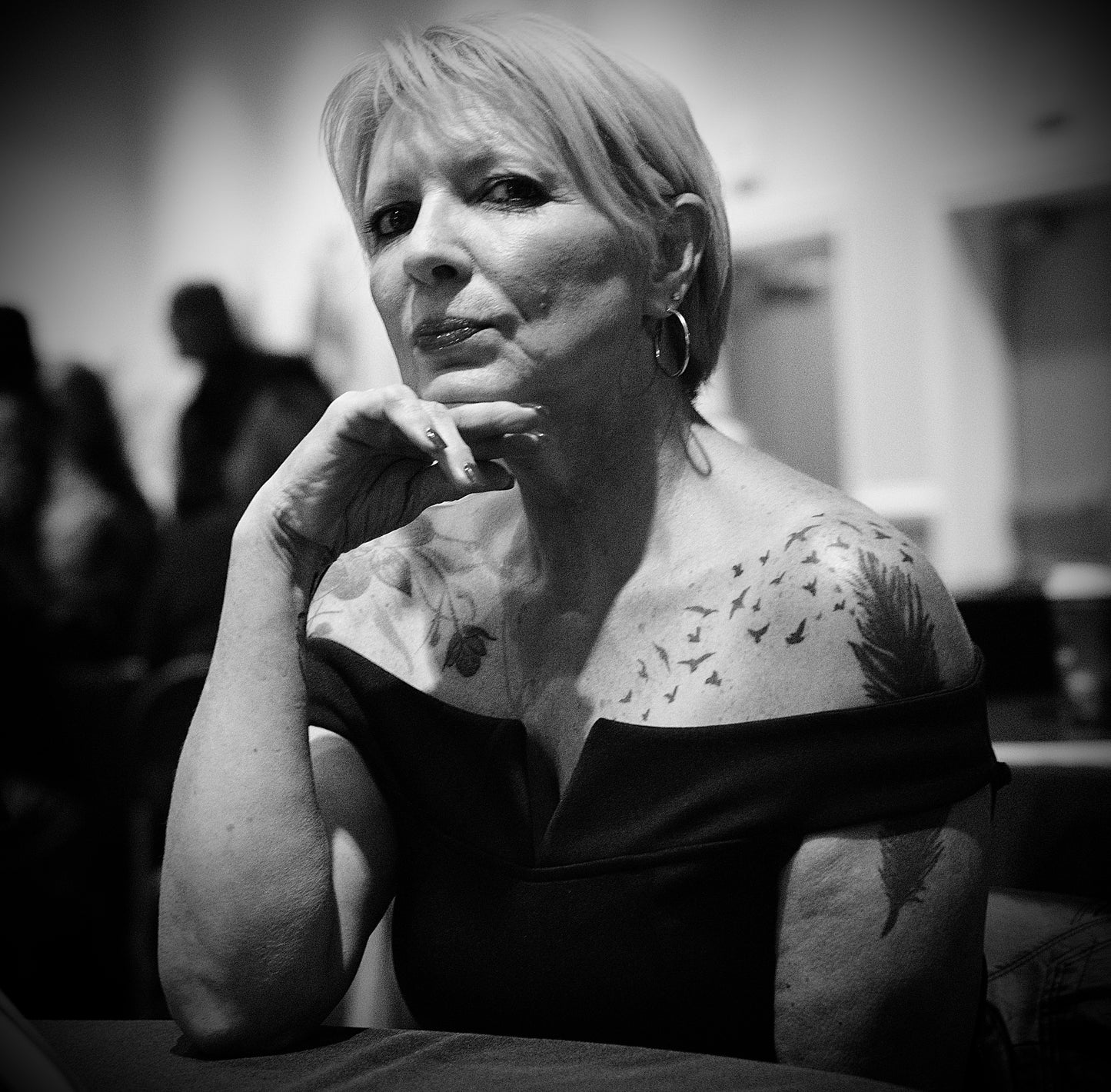 Woman with Short Hair in Off-Shoulder Dress