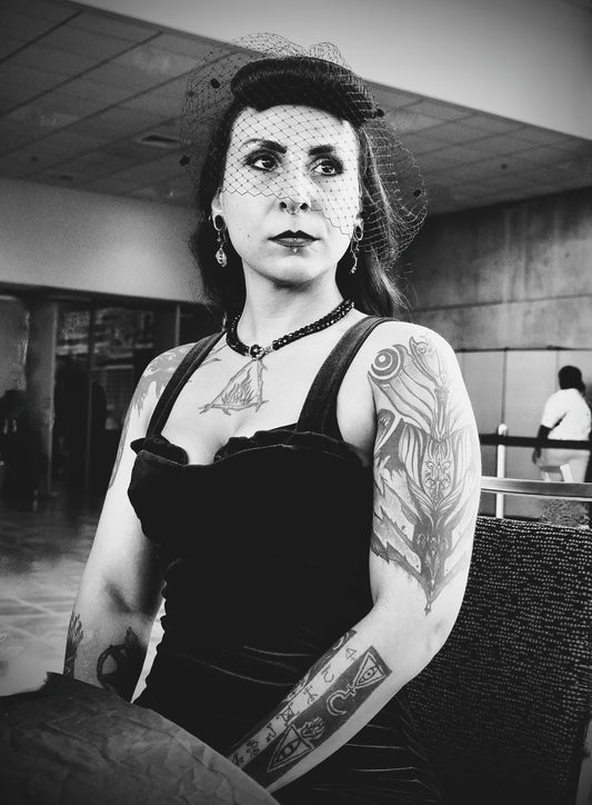 Tattooed Woman in Mesh Veil