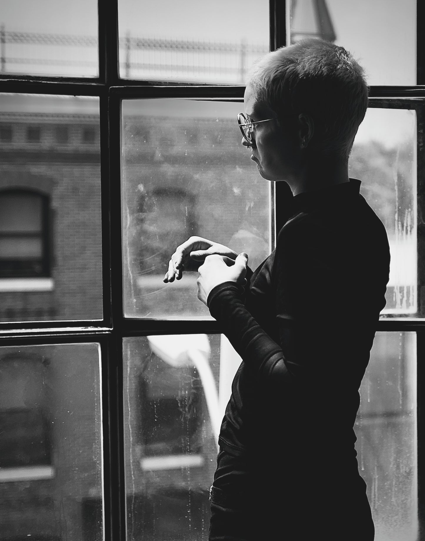 Short Haired Punk Girl Gazing Out Window