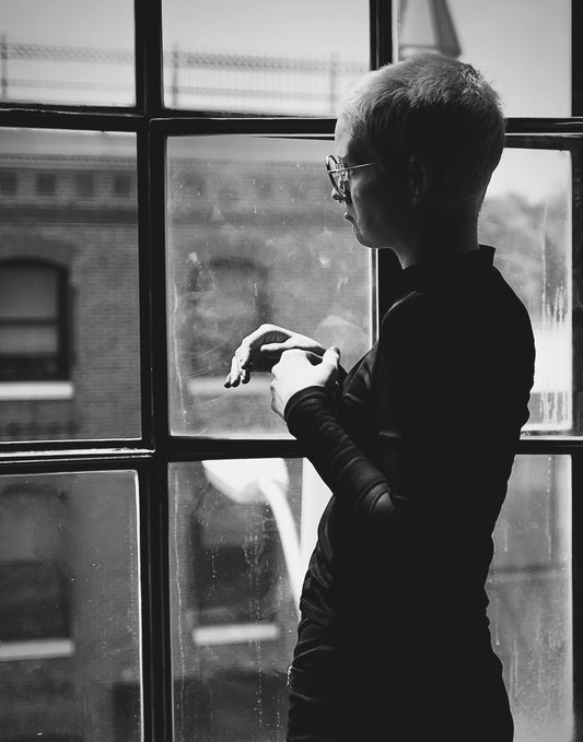 Short Haired Punk Girl Gazing Out Window