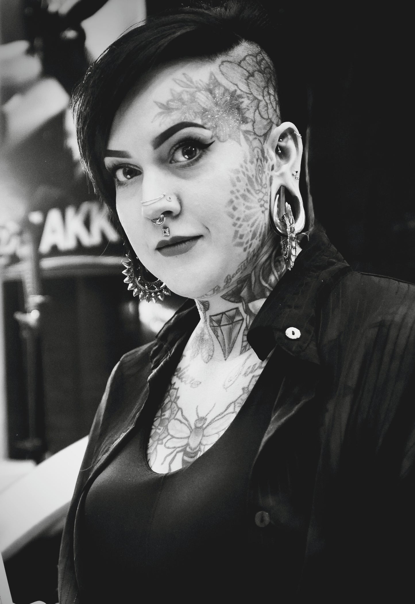 Woman with Plug and Stretched Ear Lobes