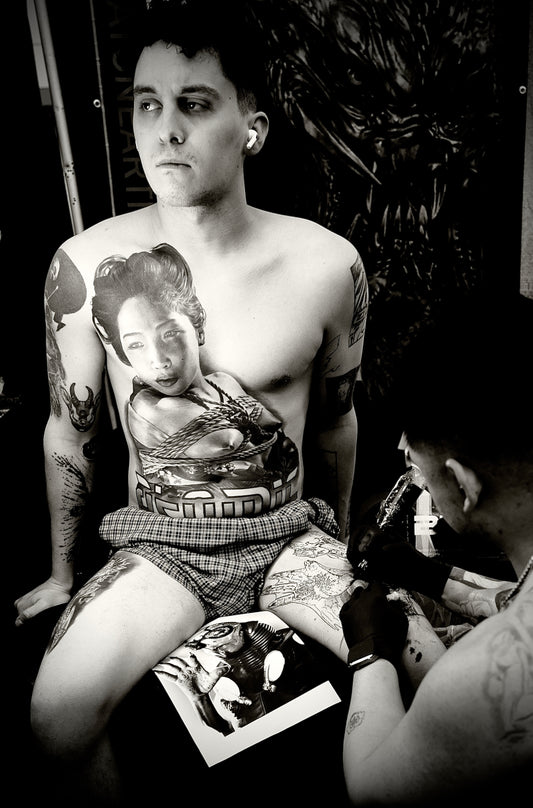 Man with Asian Woman Tattooed on Chest